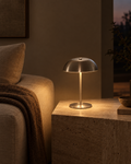 Nuvo brushed steel cordless table lamp on a marble kitchen counter