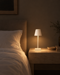 Cono small white USB touch lamp on a guest room nightstand